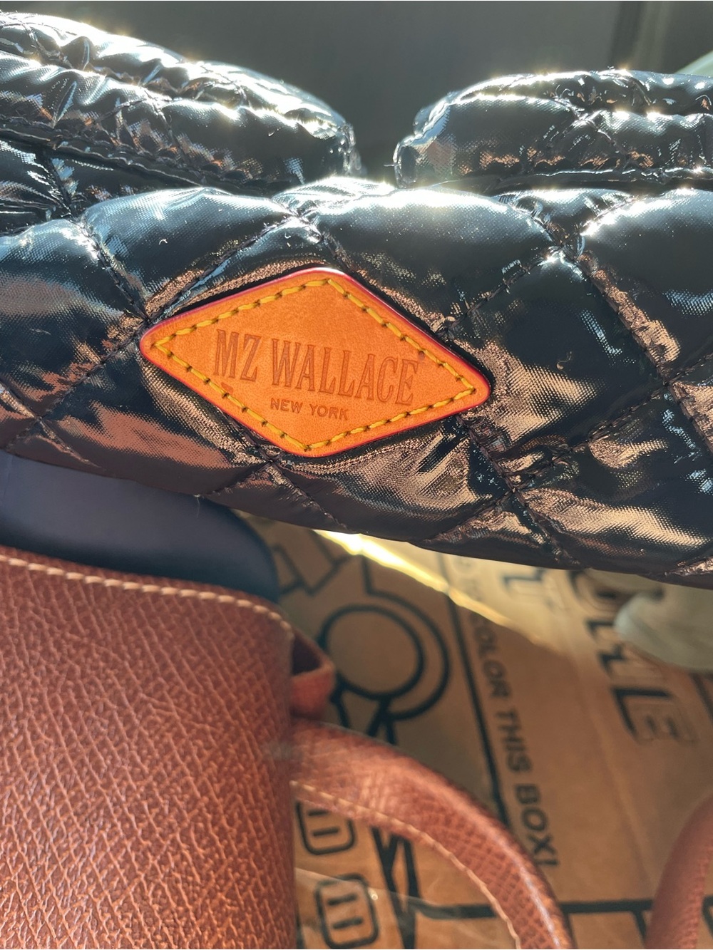 MZ Wallace Black Quilted Slip-On with Tan Leather Logo Patch